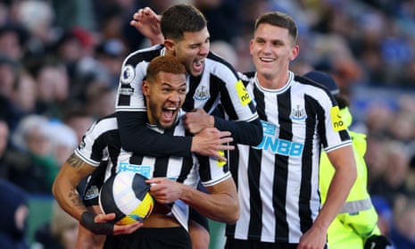 Joelinton celebrates with teammates after scoring Newcastle’s third goal against Leicester
