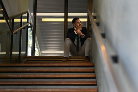Inglis sitting at the top of a staircase