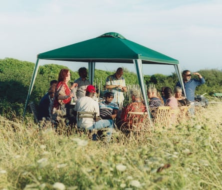 A group of people under a gazebo