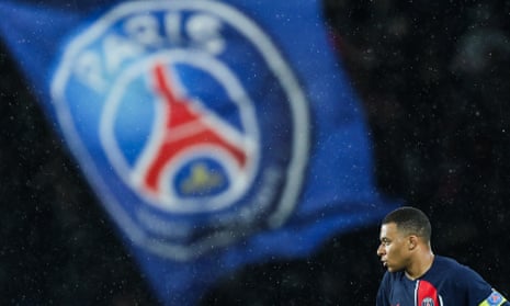 Kylian Mbappé and a PSG flag
