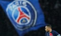 Kylian Mbappé and a PSG flag