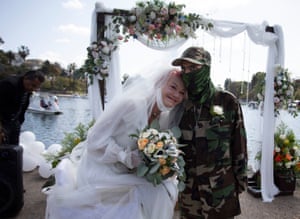 Valerie Zeller and her husband, Henry, face the audience after taking their vows at Echo Park Lake in Los Angeles