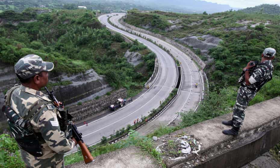 Members of India’s security forces patrol the Jammu-Srinagar highway in Nagrota near Jammu on Wednesday.