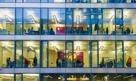 Workers sat on different floors of a glass fronted office