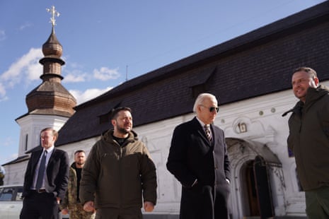 US President Joe Biden (2nd R) walks next to Ukrainian President Volodymyr Zelenskiy (3th L) as he arrives for a visit in Kyiv on 20 February 2023.