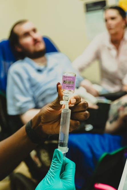 Close-up view of a nurse adding medicine to a syringe