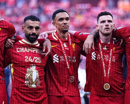 Robertson (right) celebrates winning the 2024-25 Premier League with Mohamed Salah and Trent Alexander-Arnold