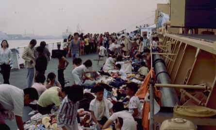 Safe haven: the rescued people look through donated clothing on the deck of the Wellpark.
