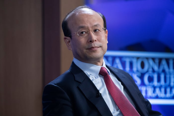 The ambassador of the People's Republic of China to Australia, Xiao Qian, at the National Press Club in Canberra this afternoon. He is wearing a suit and a red tie, and has glasses on