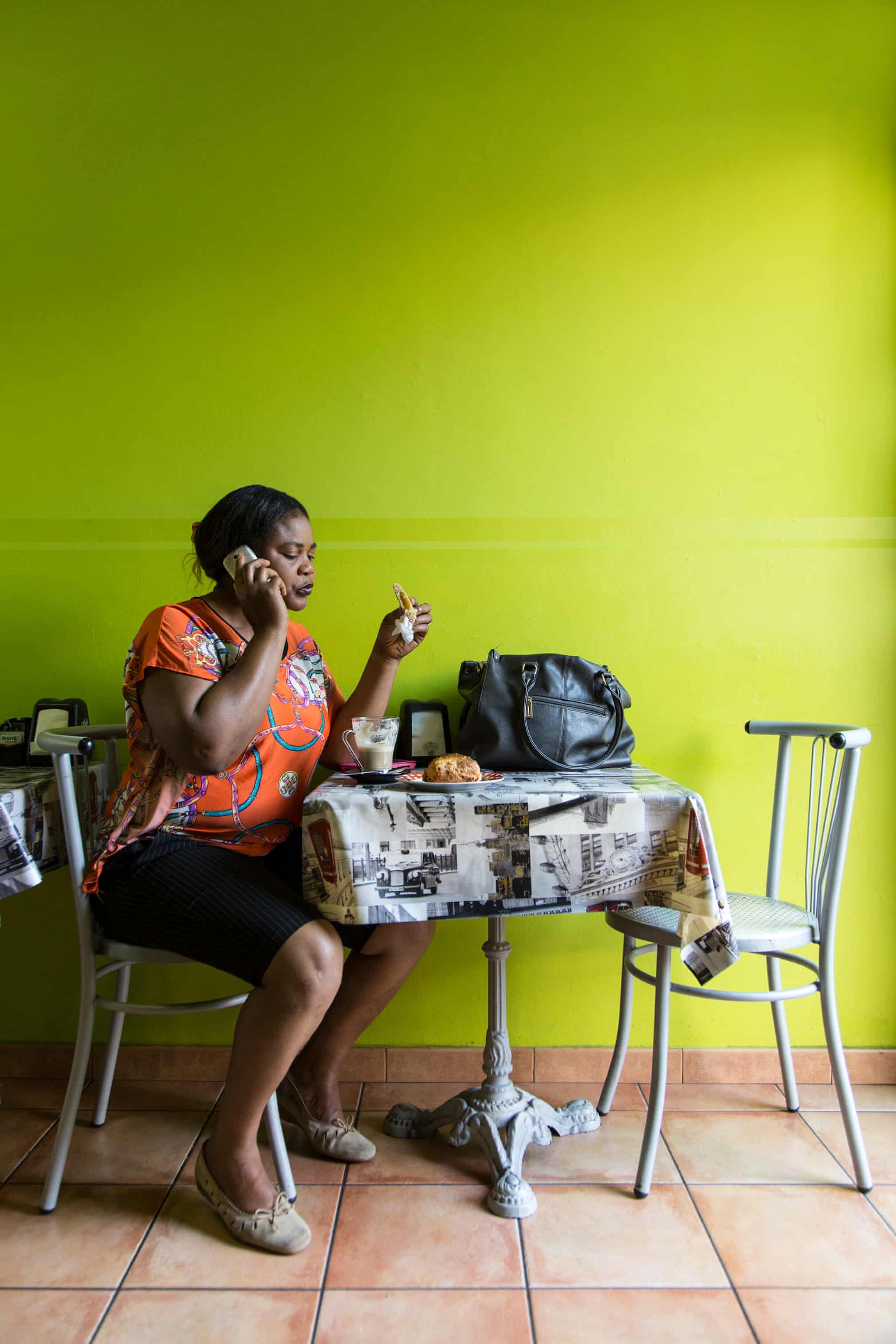 Princess Inyang Okokon, a former victim of sex trafficking, in a coffee shop in Asti, Italy.
