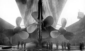 Workers inspect the propellers of the  Titanic in dry dock in 1916. 