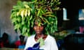 Woman carrying vegetation on her head