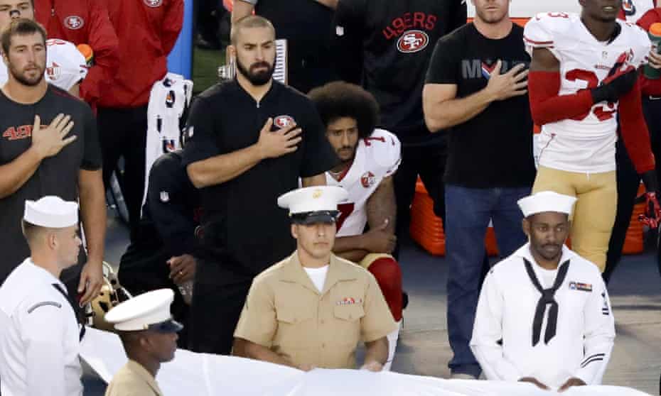 San Francisco 49ers quarterback Colin Kaepernick kneels during the national anthem before the team’s NFL preseason football game against the San Diego Chargers on Thursday.