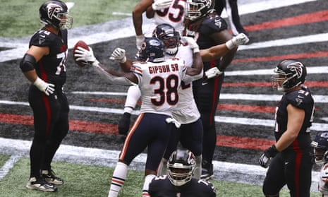 The Chicago Bears celebrate after a game clinching interception