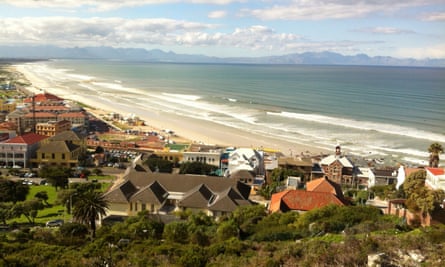 Muizenberg beach. with golden sand and long, gentle waves.