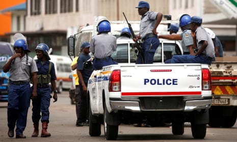 Police patrol the streets of Harare