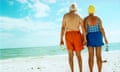 Elderly Couple Holding Hands on Beach<br>elderly couple