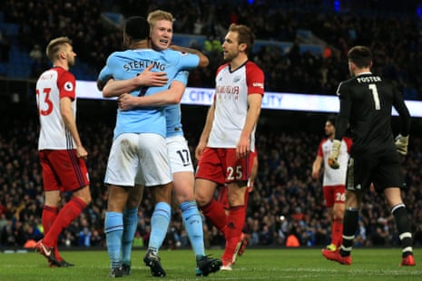 De Bruyne celebrates with Sterling after scoring the second for City.