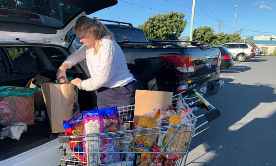 Keely Bell packs groceries destined for food parcels in Lyall Bay, Wellington.