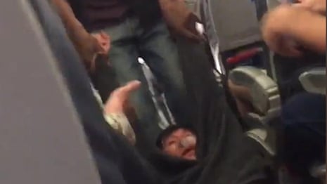 United Airlines passenger forcibly removed from overbooked flight – video