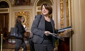 Amy Klobuchar heads to the Senate floor for the impeachment trial of Donald Trump in Washington DC, on 24 January.
