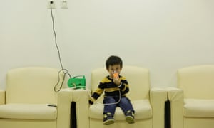 Hanhan, three, receives nebuliser therapy after a Beijing red alert for air pollution in 2015.