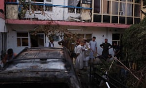 Damage at the scene of an US drone attack near the Hamid Karzai International airport, in Kabul