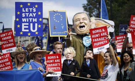 Anti-Brexit campaigners display puppets of Nigel Farage, Boris Johnson and Jeremy Hunt.