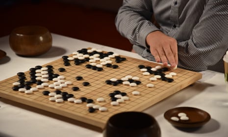 Fan Hui makes a move against AlphaGo in DeepMind’s HQ in King’s Cross