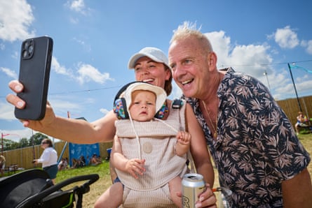Cook has his photo taken with Charley and her son Remi, 7 months, from Somerset
