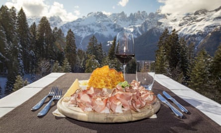 cheese and charcuterie with mountain view  at Rifugio Dosson.