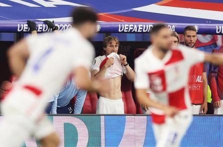 Luka Modric of Croatia reacts as he watches the match after being substituted in the Euro 2024 group game against Italy