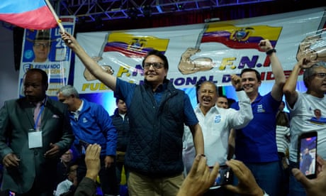Fernando Villavicencio waves the Ecuador national flag during a campaign event minutes before he was shot to death outside a school in Quito on 9 August.