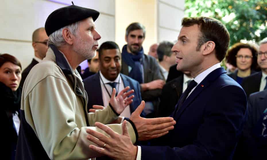 French mathematics teacher Pierre Coste speaking with President Emmanuel Macron about pensions
