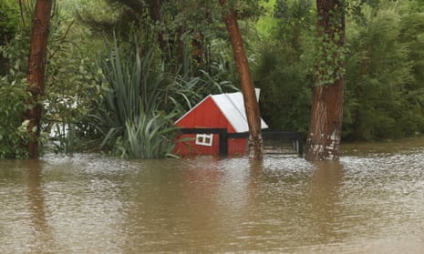 Floodwaters are pictured around homes in Kumeu in Auckland.