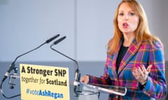 Ash Regan speaks at a lectern with microphones and a sign saying 'A stronger SNP together for Scotland #voteAshRegan'