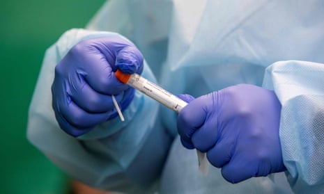 A health worker prepares to administer a swab test. Seven cases of the India variant have been identified in Northern Ireland.
