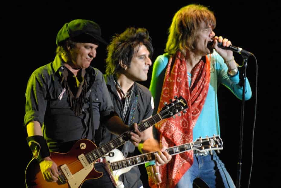 Sylvain Sylvain in the foreground, playing with New York Dolls in 2008.