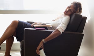 Businesswoman sleeping in office chair