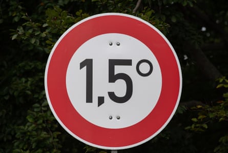 A sign drawing attention to the Paris goal of limiting global temperature increase to 1.5C, photographed on 3 October 2021 at a ‘Climate Justice Camp’ in Berlin