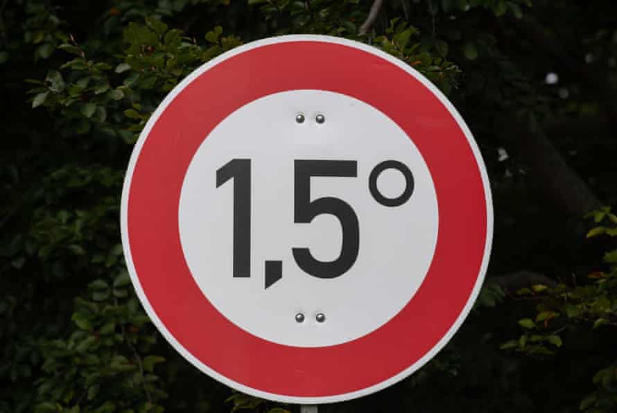 A sign drawing attention to the Paris goal of limiting global temperature increase to 1.5C, photographed on 3 October 2021 at a ‘Climate Justice Camp’ in Berlin