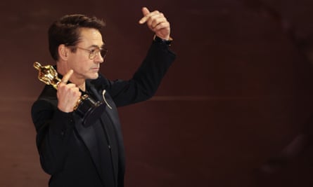 Robert Downey Jr with his best supporting Oscar.