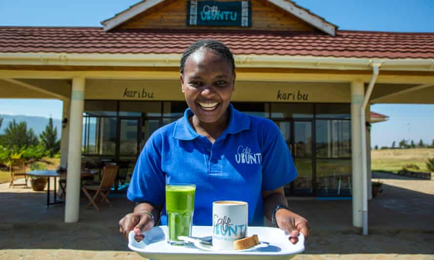 Ubuntu Cafe, Kenya, woman holding tray of drinks