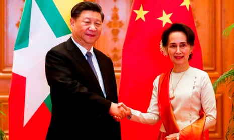 Xi Jinping and Aung San Suu Kyi shake hands at the Presidential Palace in Naypyidaw.