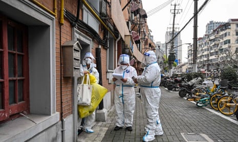 health workers wearing protective clothing in Shanghai