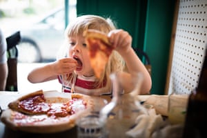 Category: Portrait. Title: Pizza Heaven. A child enjoying a pizza in Crystal Palace, London