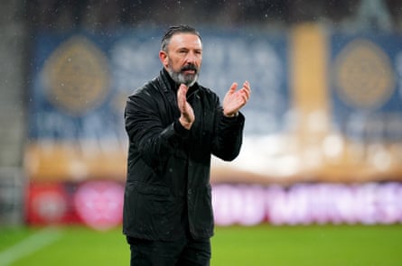 The Hearts manager, Derek McInnes, applauds the fans after the game at Tynecastle