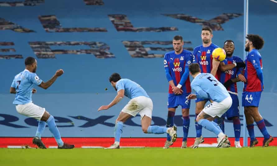 Raheem Sterling (left) scores Manchester City’s fourth goal from a free-kick.