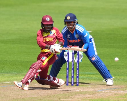 The West Indies cricketer Shemaine Campbell plays a sweep shot, with India wicket-keeper Richa Ghosh in position behind her, during a Women’s T20 World Cup warm-up game in Cardiff.