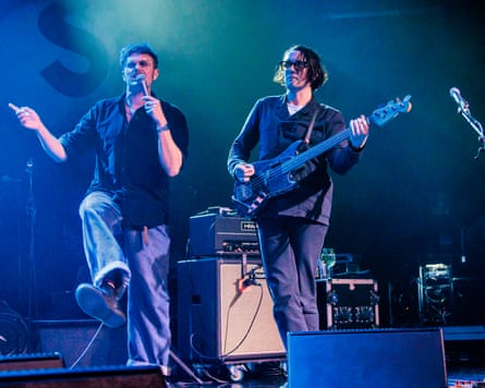 Smith and Needham performing with the band in Milan last year.